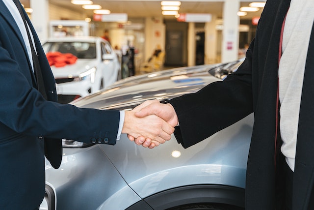 Shaking hands after financing a car